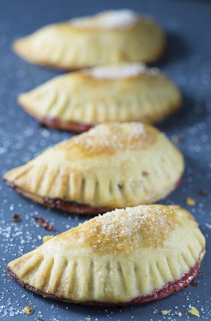Cranberry Apple Empanadas - cranberry and apple pie filling wrapped in flaky buttery crust.