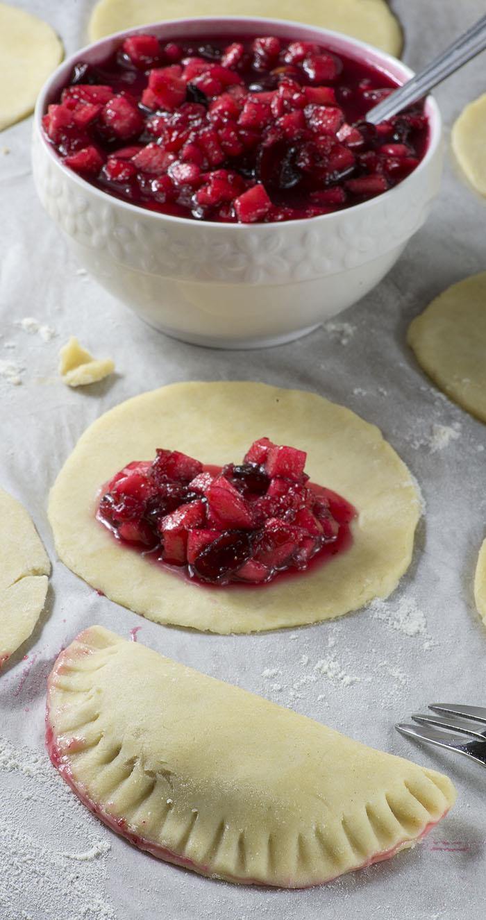 Cranberry Apple Empanadas - cranberry and apple pie filling wrapped in flaky buttery crust.