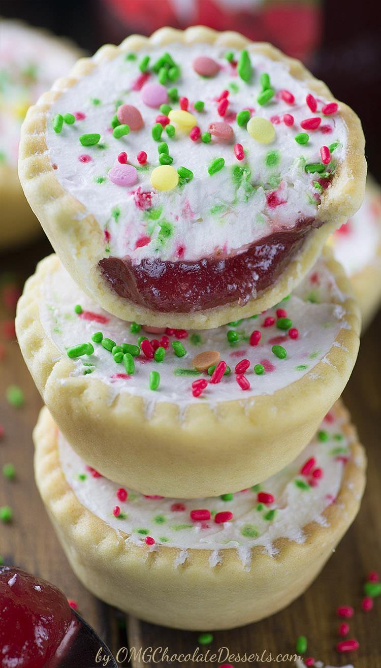 Sweet little cookie cups filled with strawberry jam and no bake cheesecake will be your original and perfect Christmas cookies decision! Don’t miss the beautiful Strawberry Jam Cheesecake Cookies