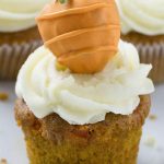 Carrot cake cupcake with a chocolate covered strawberry on top