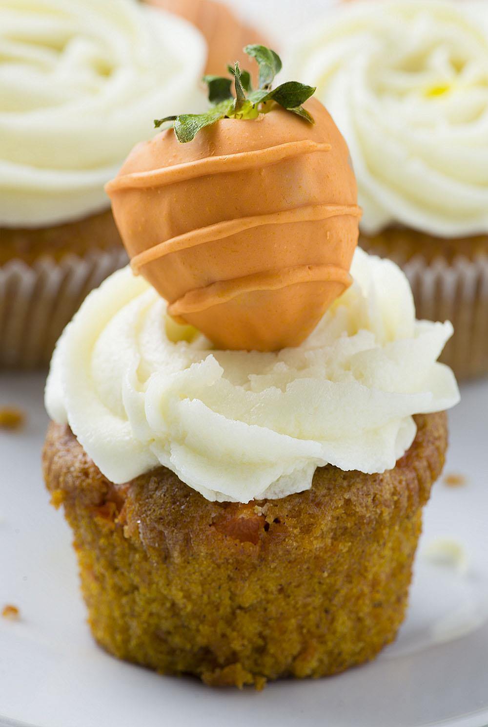 Carrot Cake Cupcakes - absolutely perfect Easter dessert. Easy to make and super moist carrot cupcakes garnished with cute Carrot Chocolate
