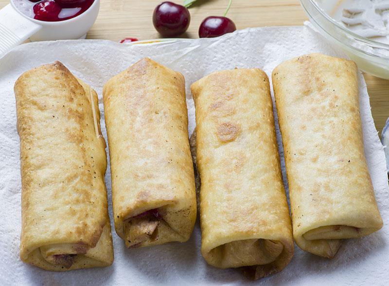 Cherry Cheesecake Chimichangas are irresistibly scrumptious, crispy, deep fried burritos filled with sweet, cherry cheesecake and rolled into cinnamon sugar.