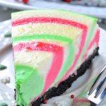 Colorful piece of Christmas cheesecake in a plate.