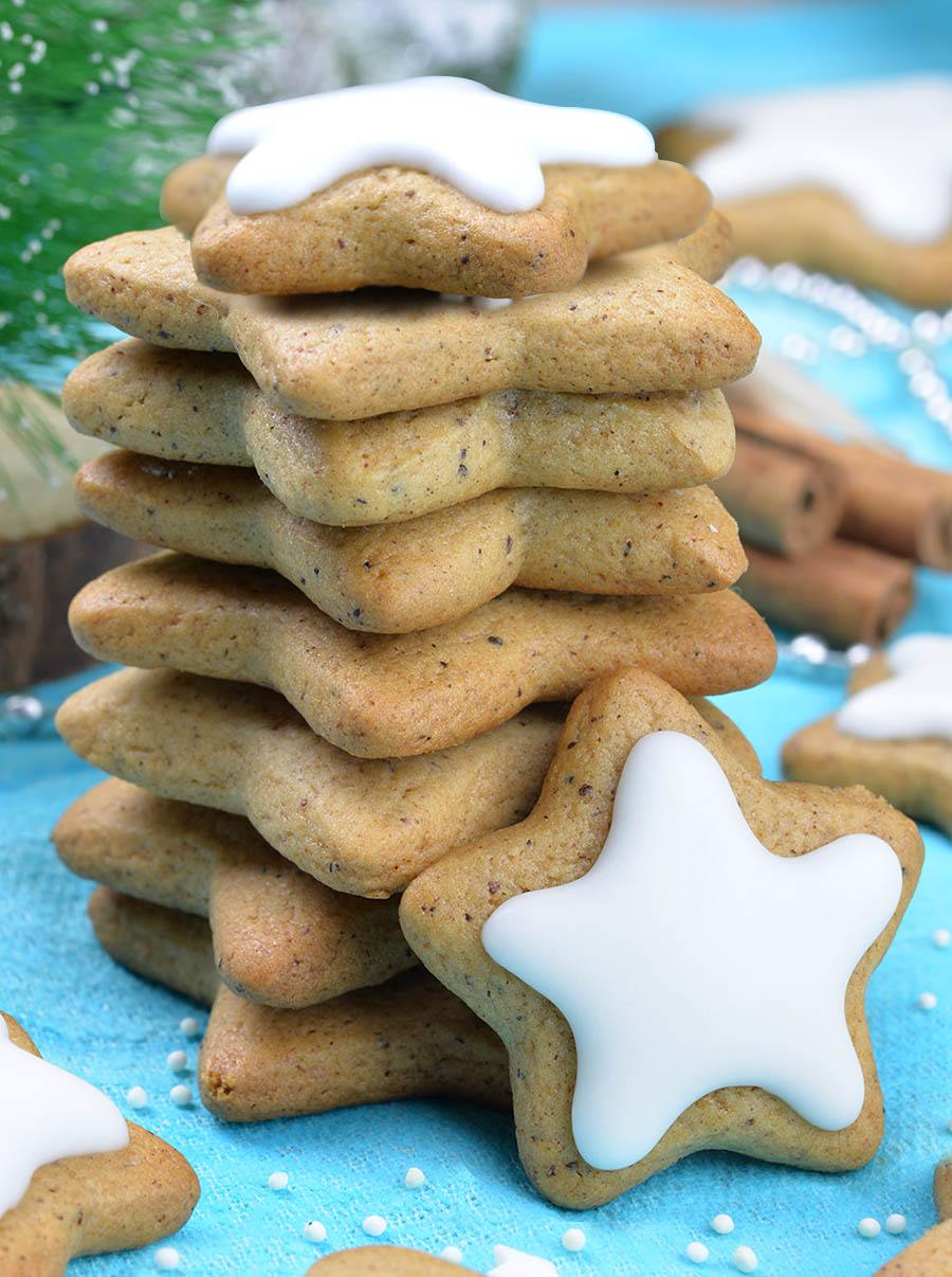 Gingerbread cookies as stars shape for Christmas, on a parchment