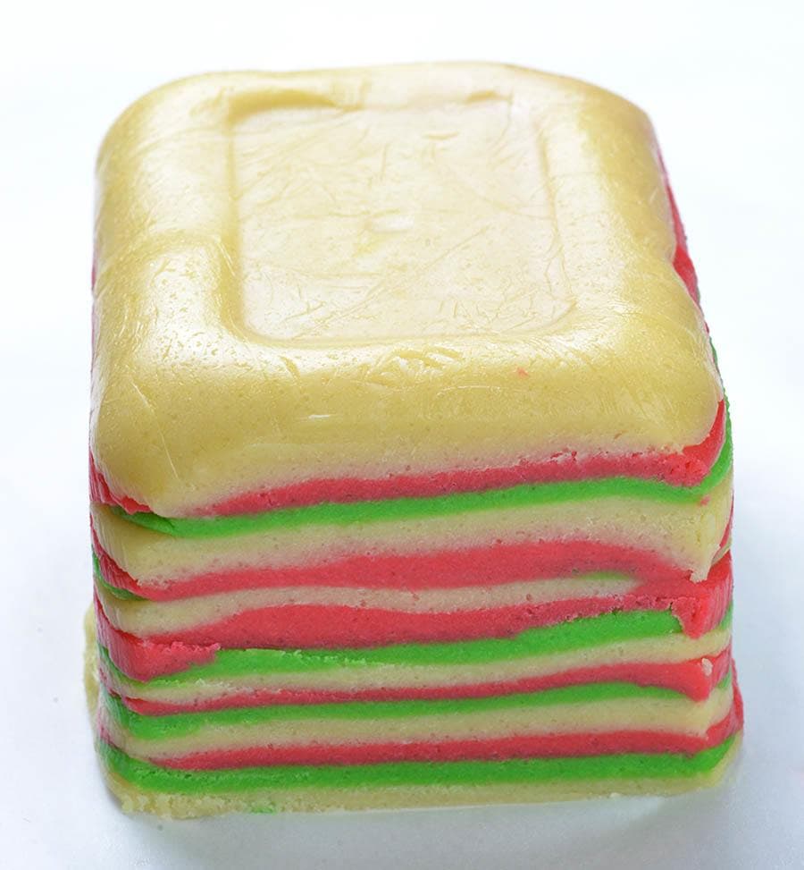 Layers of red, white and green cookie dough for sugar cookies. 