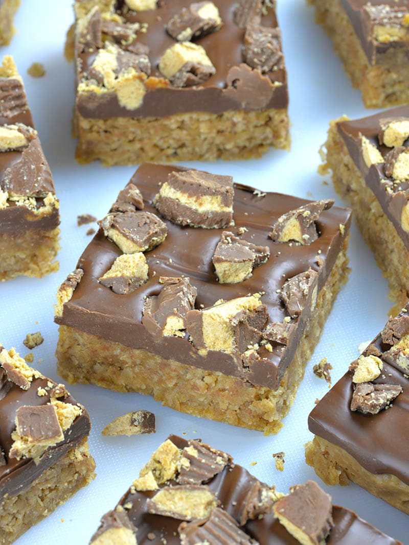 Bunch of Reese's Peanut Butter Oatmeal Bars on a table. 