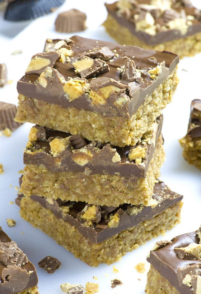 Three pieces of Reese's Peanut Butter Oatmeal Bars on a table.