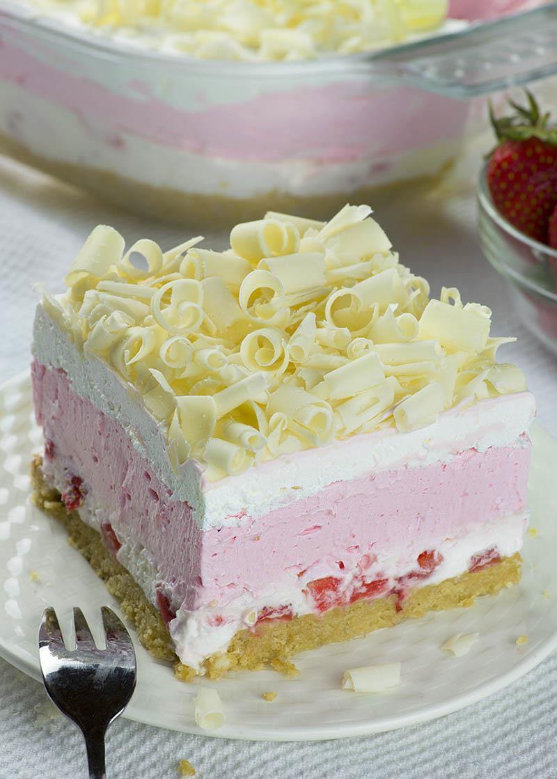 No Bake Strawberry Jello Lasagna in a white plate.