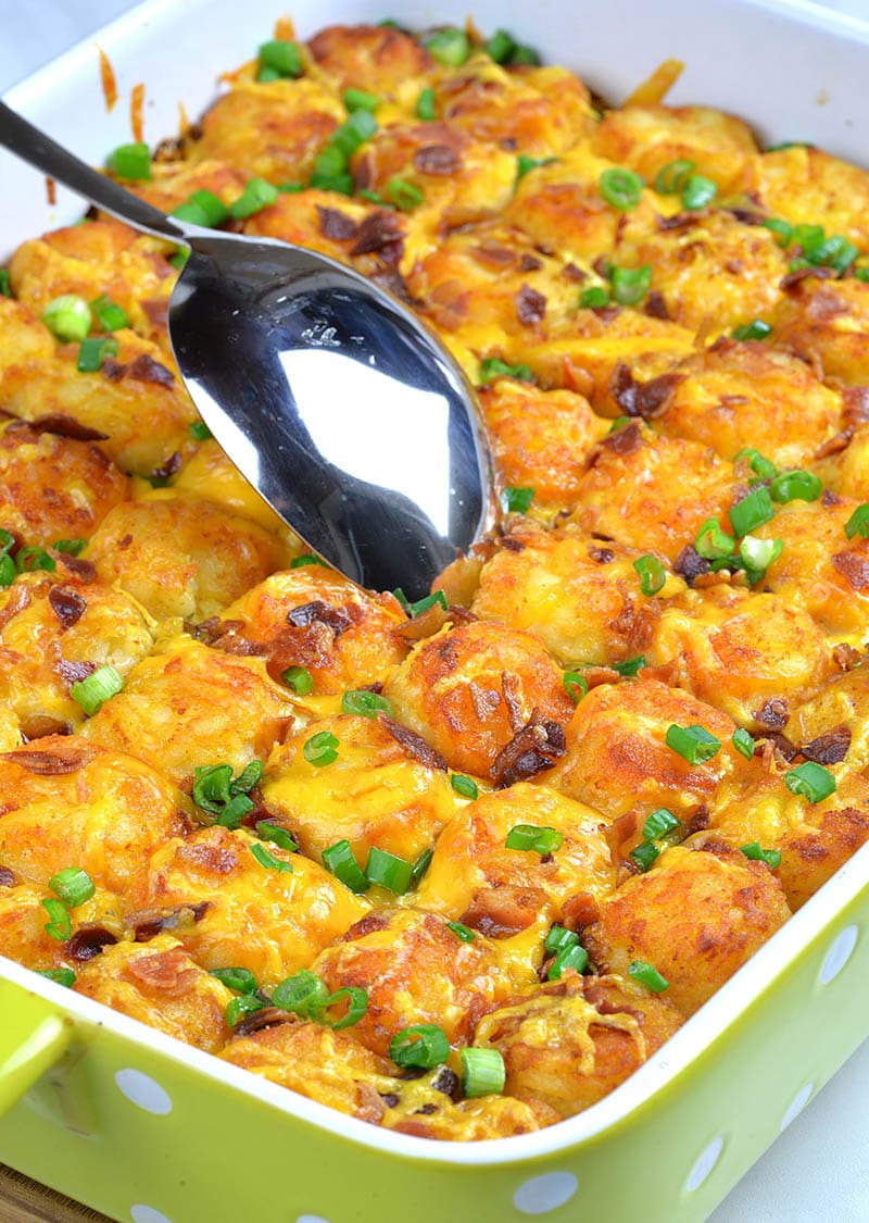 Baked Tater Tot Casserole with big spoon.