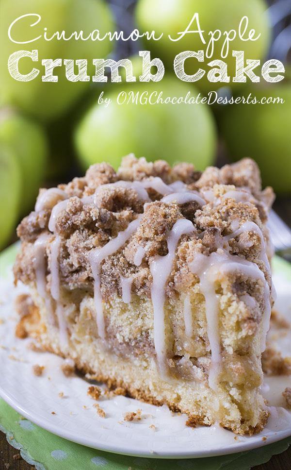 Piece of Cinnamon Apple Crumb Cake on a white plate with a bunch of apples behind.