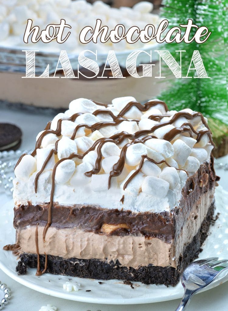 Hot Chocolate Lasagna - no bake layered dessert with Oreo crust, hot chocolate cheesecake mousse layer, chocolate pudding, whipped cream and mini marshmallows.