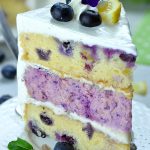 Image of a slice of Lemon Blueberry Cheesecake Cake