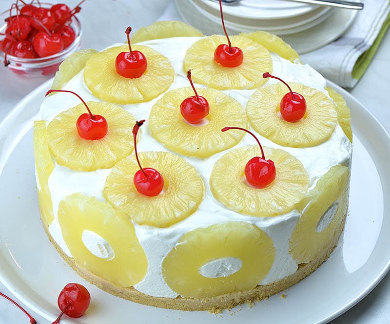 No bake pineapple cake with maraschino cherries and pineapple rings.