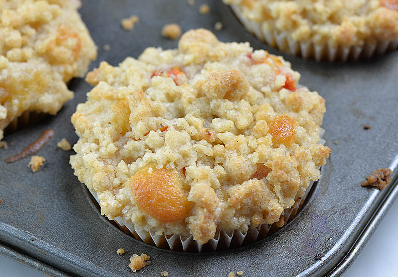 Baked peach muffin in the pan.