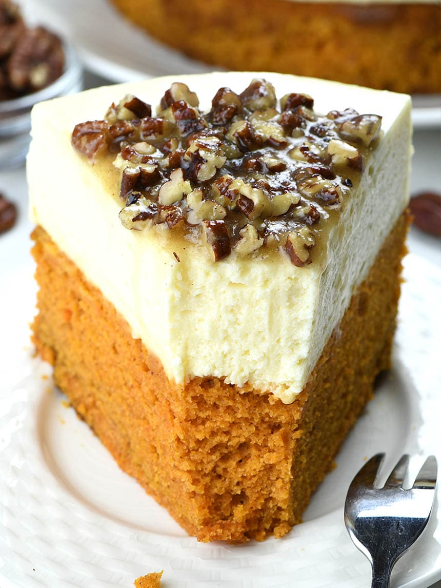 This year you can make a fun twist on classics and turn them into one delicious and festive combo- Pumpkin Bread Cheesecake with Pecan Praline Topping.