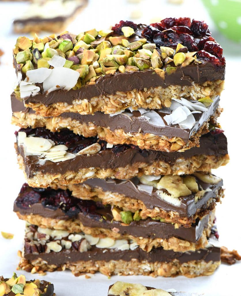 This dark chocolate granola bark has granola, nuts, coconut and dried cherries mixed inside and sprinkled on top for a crunchy dessert 