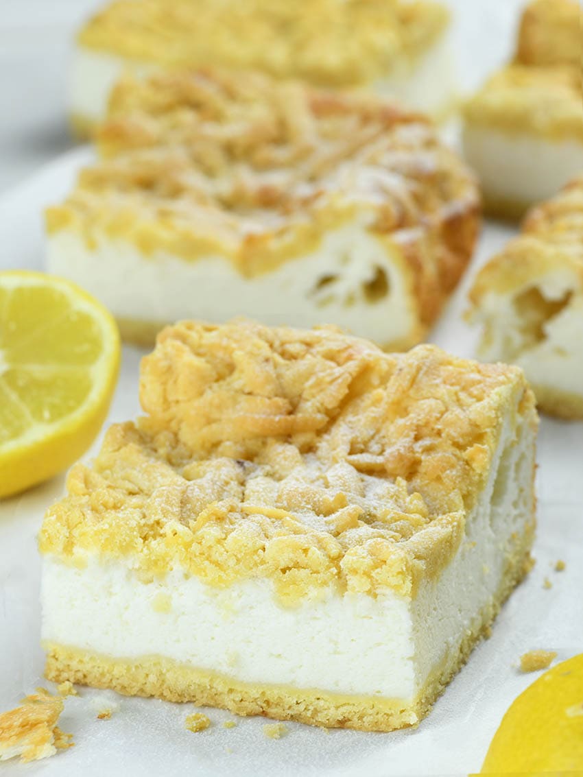 Lemon Yogurt Square in front of many other squares with lemon beside.