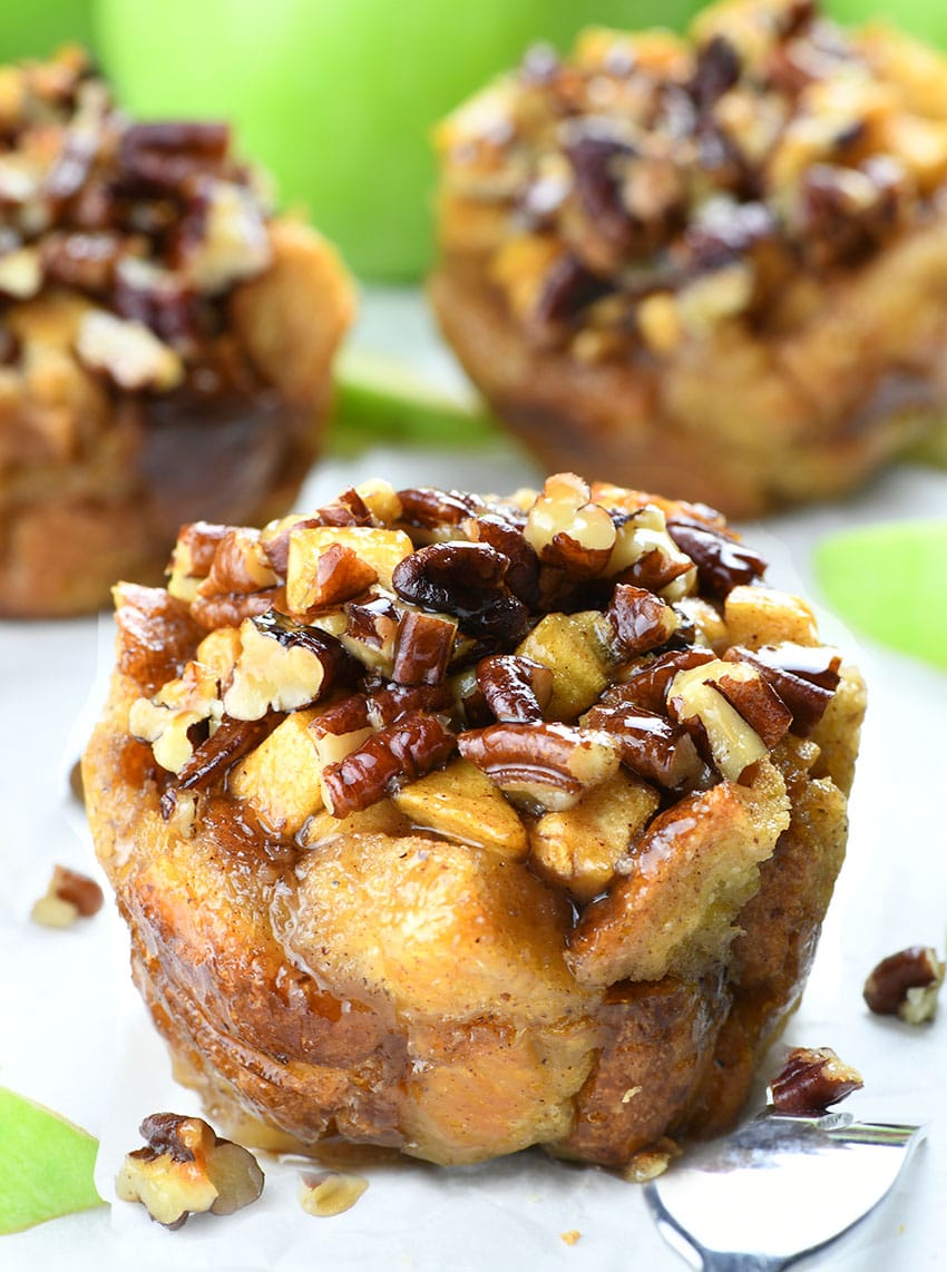 Apple Pecan French Toast Cup in front of two other and bunch of apples.