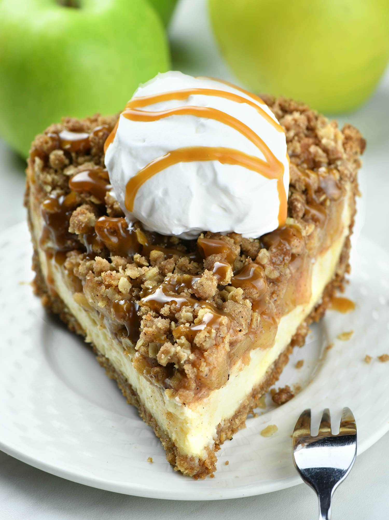A slice of this Apple Crisp Cheesecake Pie will make you happy and satisfied even on a cold and rainy fall day.