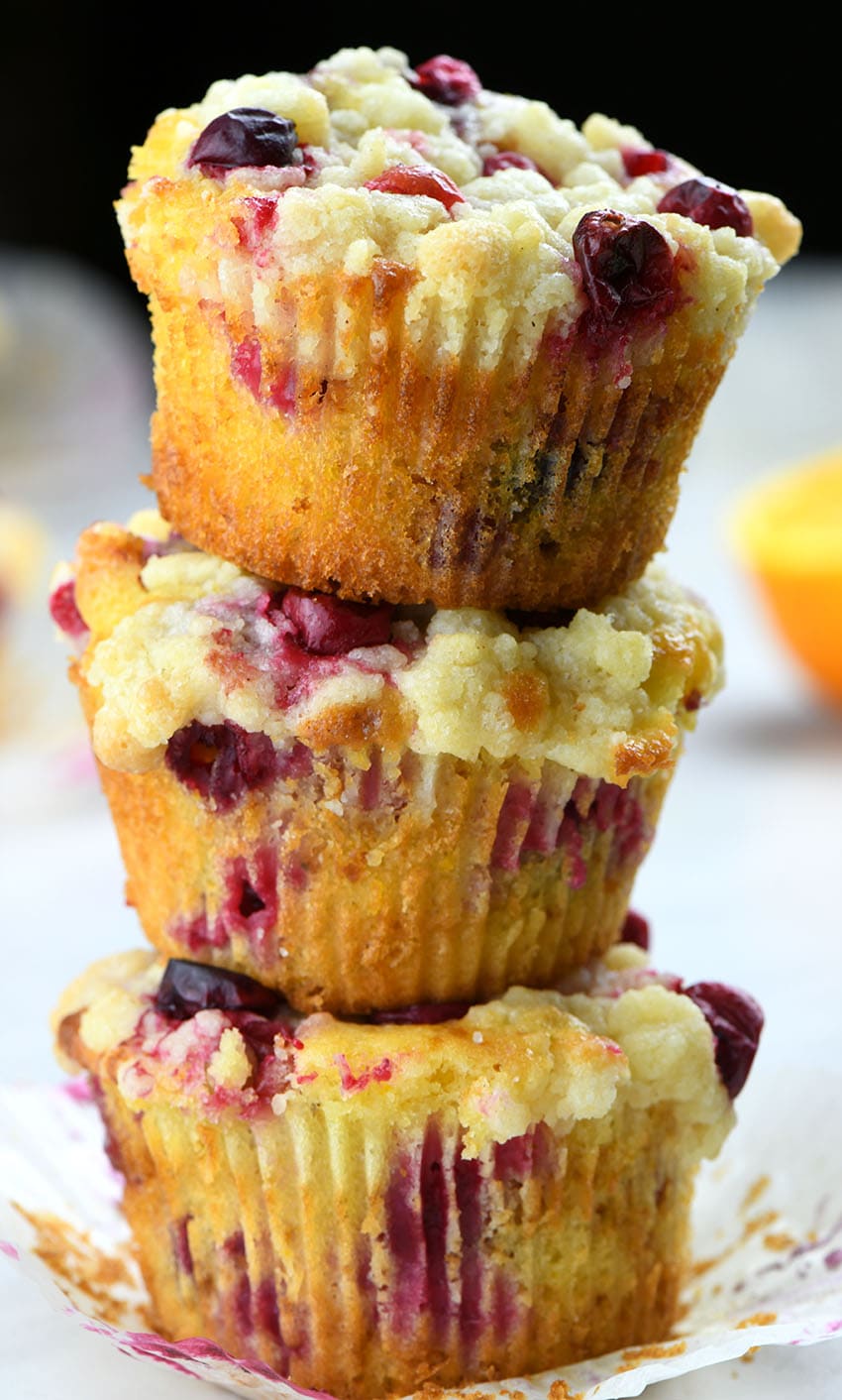 Three Cranberry Orange Muffins each on others.