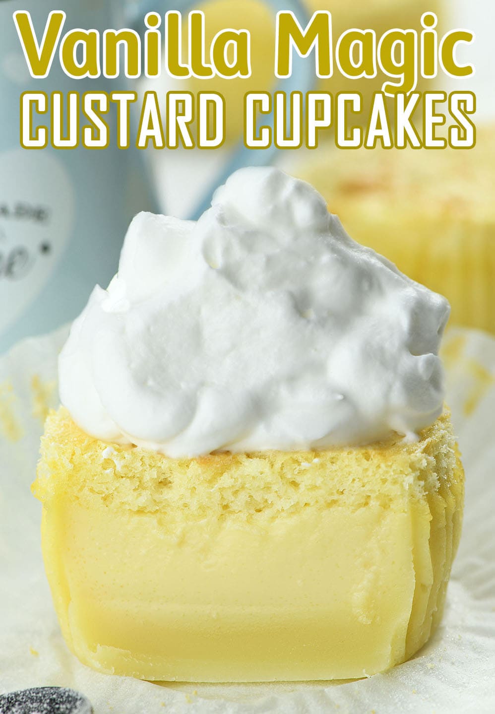 Half of Vanilla Magic Custard Cupcake topped with whipped cream.