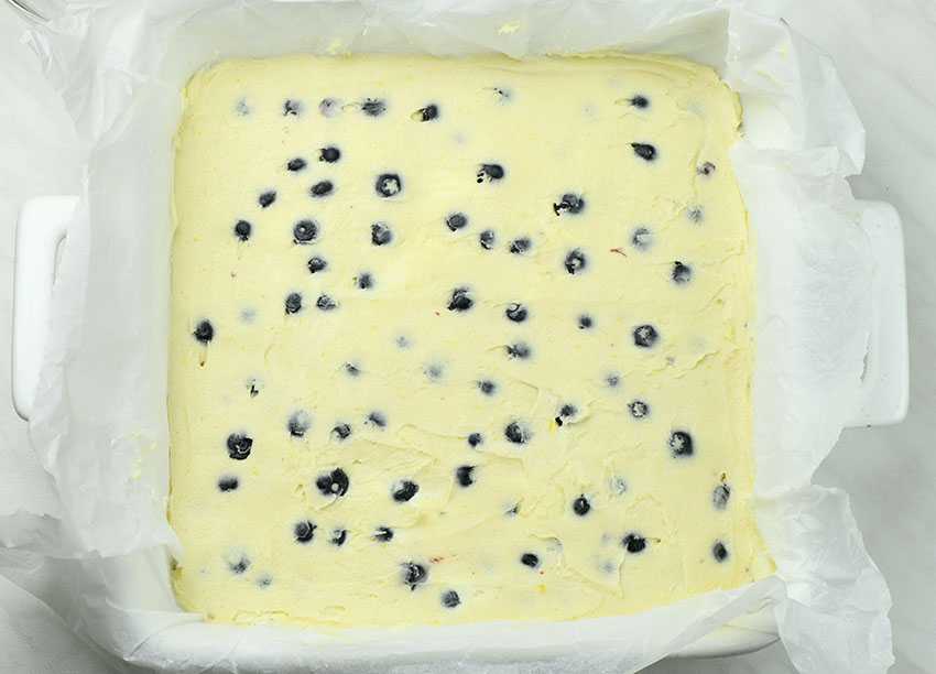 Blueberry Lemon Blondies dough in a plate.