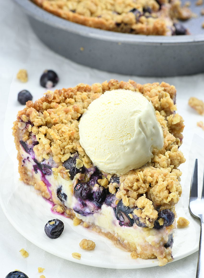 Blueberry Crumble Cheesecake Pie - graham cracker crust, smooth cheesecake filling, juicy blueberries, and crunchy topping.