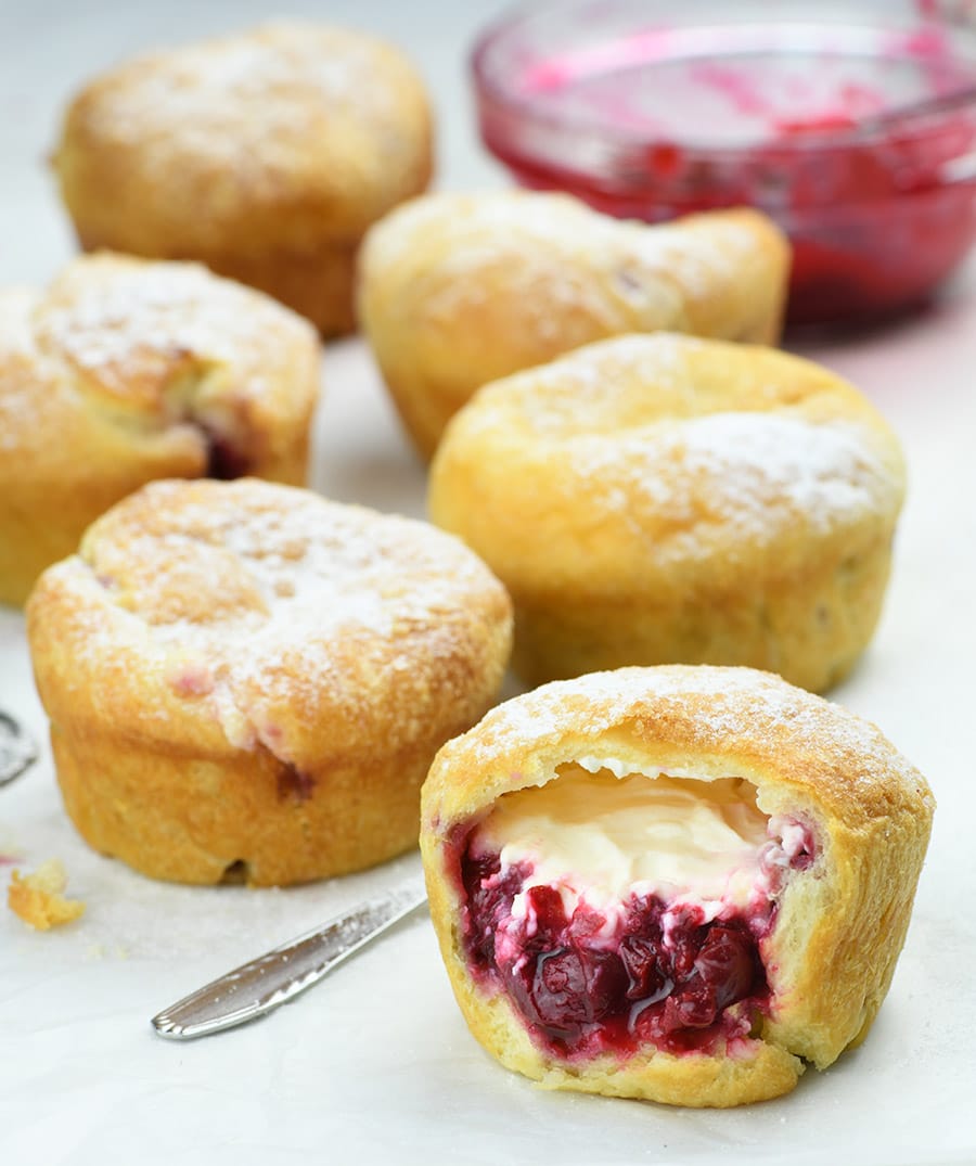 Cherry Cheesecake Crescent Muffins on a table.