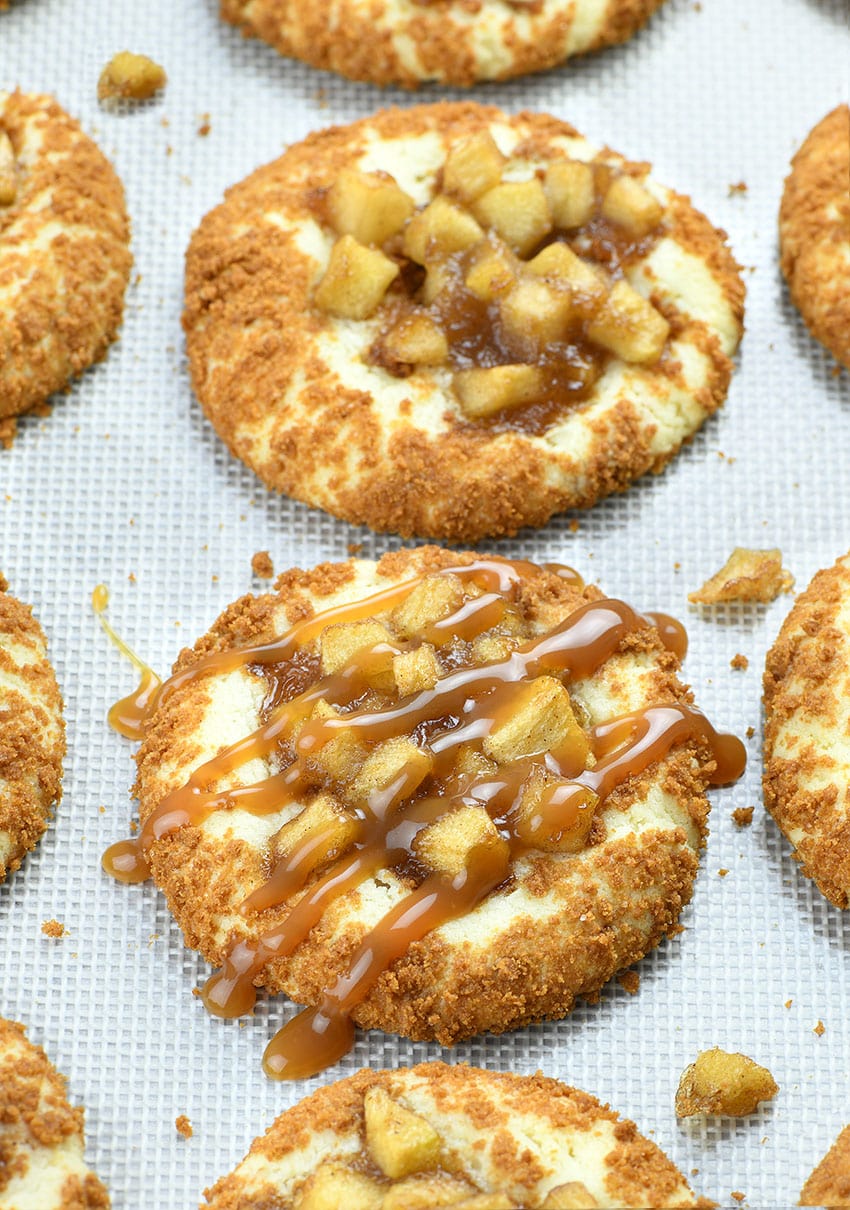 Two Apple Pie Cheesecake Cookies with caramel topping.