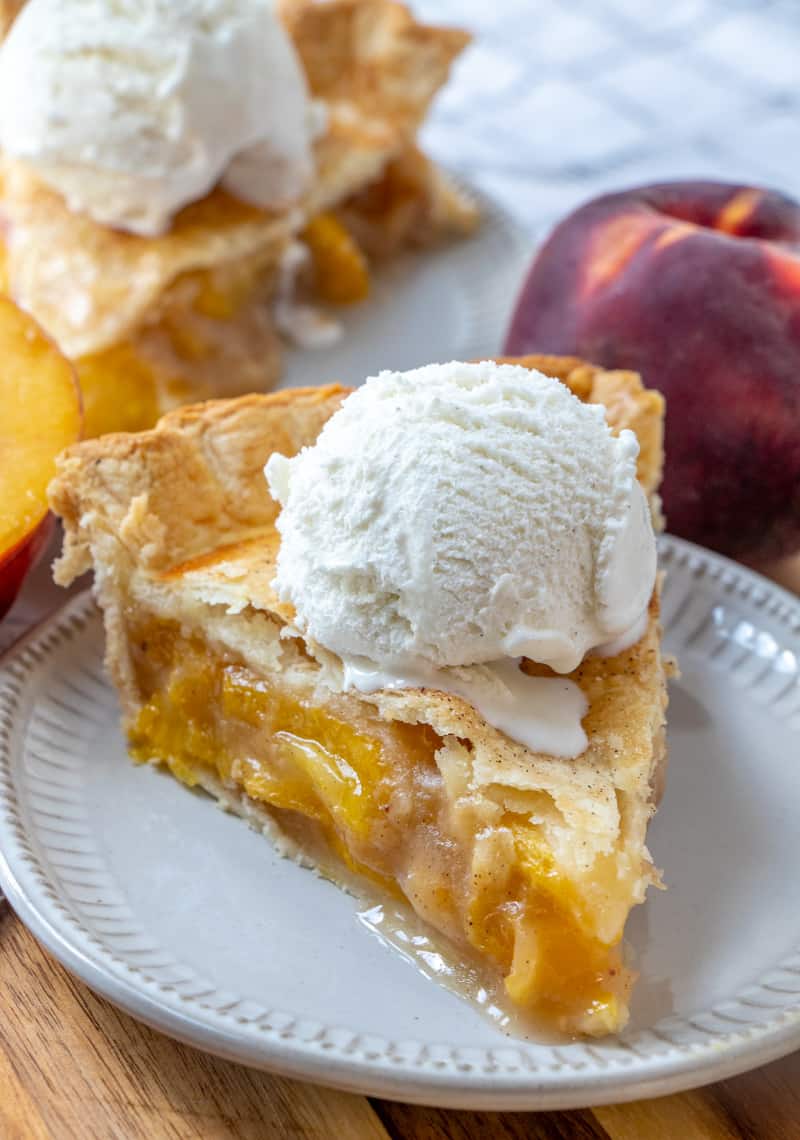 Want a trusted and tasty Peach Pie Recipe? Look no further, fresh peaches and a double crust this pie is a classic dessert you will make over and over again.