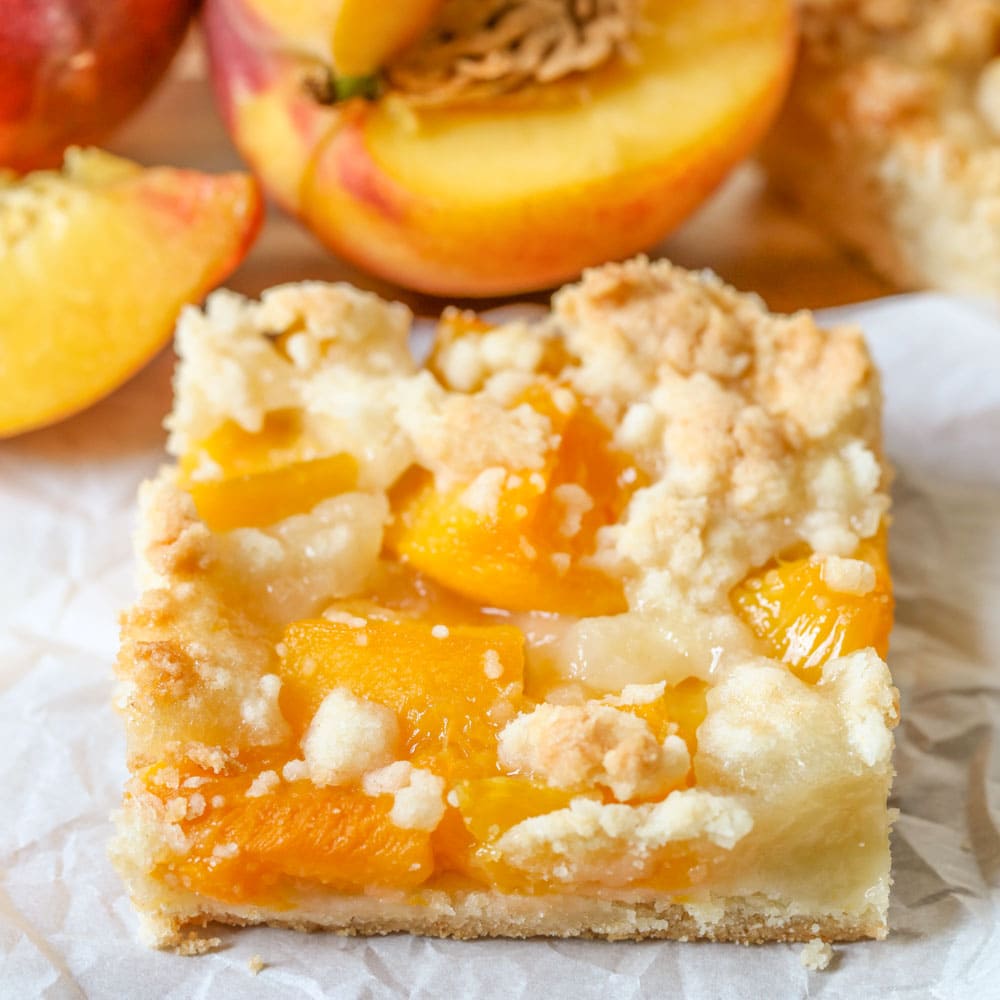 Peach Crumb Bars Are One Of Our Favorite Summer Treats! They’re Made From A Buttery Crust Layered With Juicy Peaches And A Crumbly Topping.