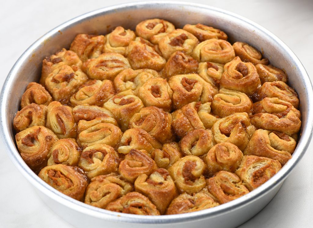 Whole Pumpkin Crescent Roll-Up Bake in a silver pan.