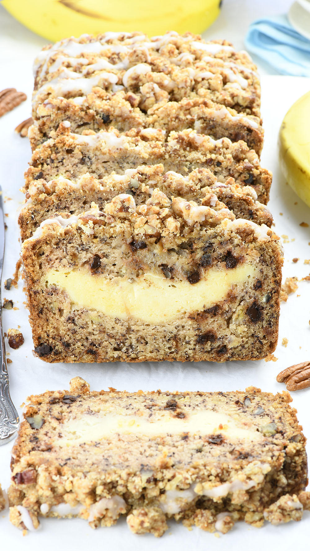 This banana bread stuffed with cream cheese filling - slices on white paper.