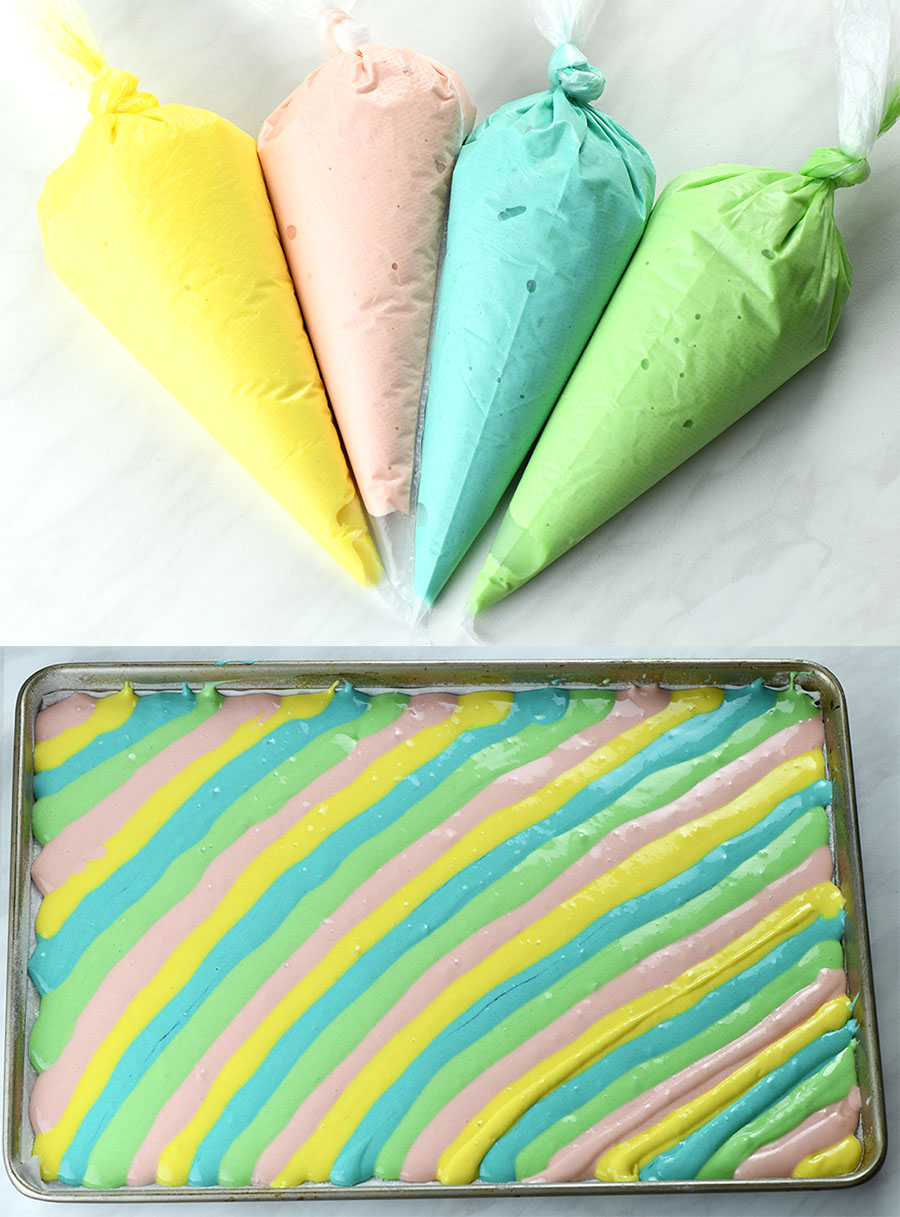 Bags with colored dough and filled dough in a baking tray.