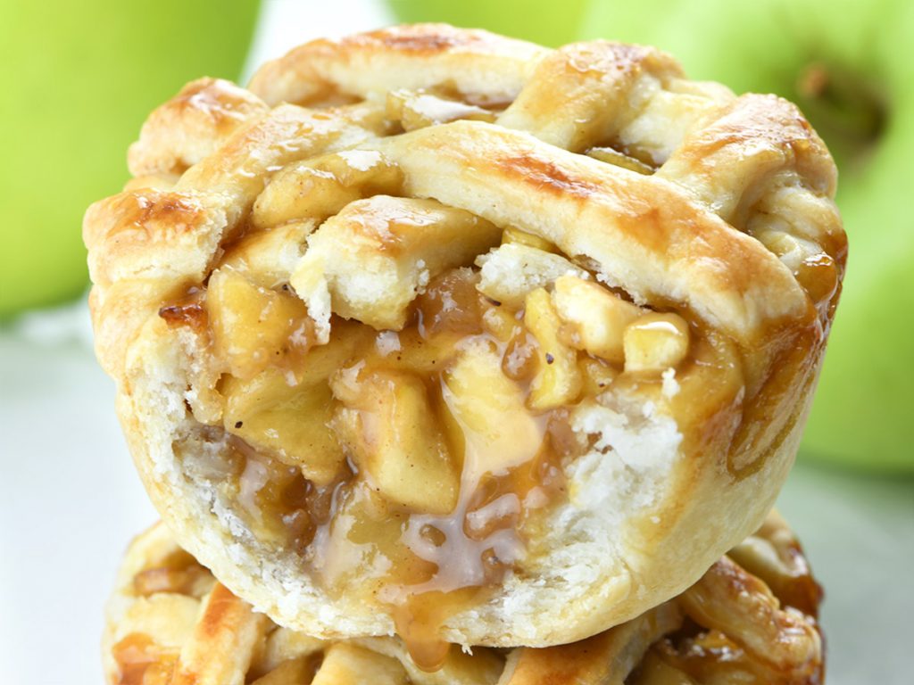 An eager slice of mini apple pie.