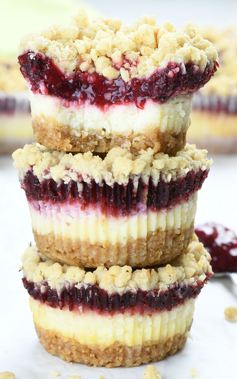 Three mini cranberry cheesecakes stacked on top of each other