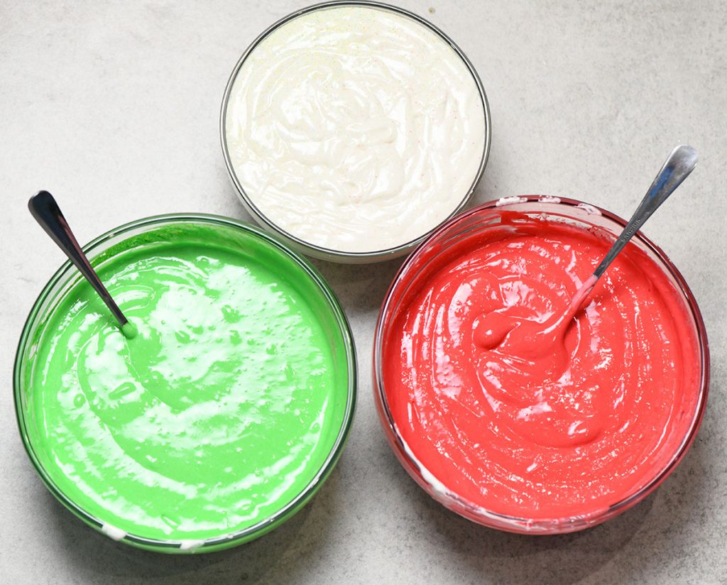 Three colors cake mix in a bowls.