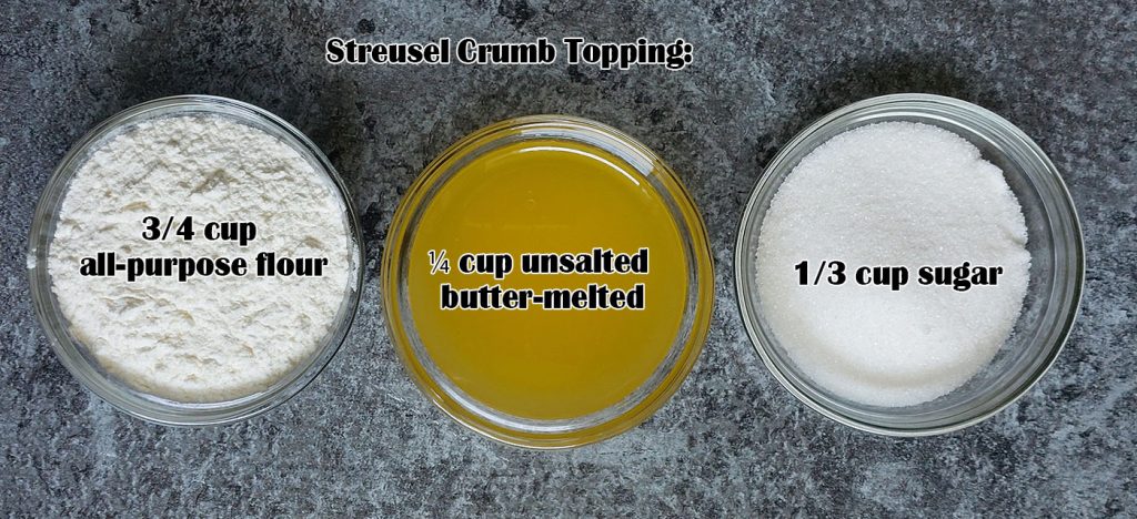 Three glass bowls with streusel crumb topping ingredients: all-purpose flour, melted unsalted butter, and granulated sugar on a dark textured surface.